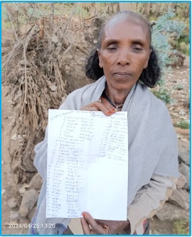 Community Leader Holds List of Children for Vaccination Hinto Hailu, a women development group leader, proudly displays a handwritten list of children under 10 from her village. She plays a key role in organizing and tracking vaccination efforts to ensure that every child in her community is protected from preventable diseases.