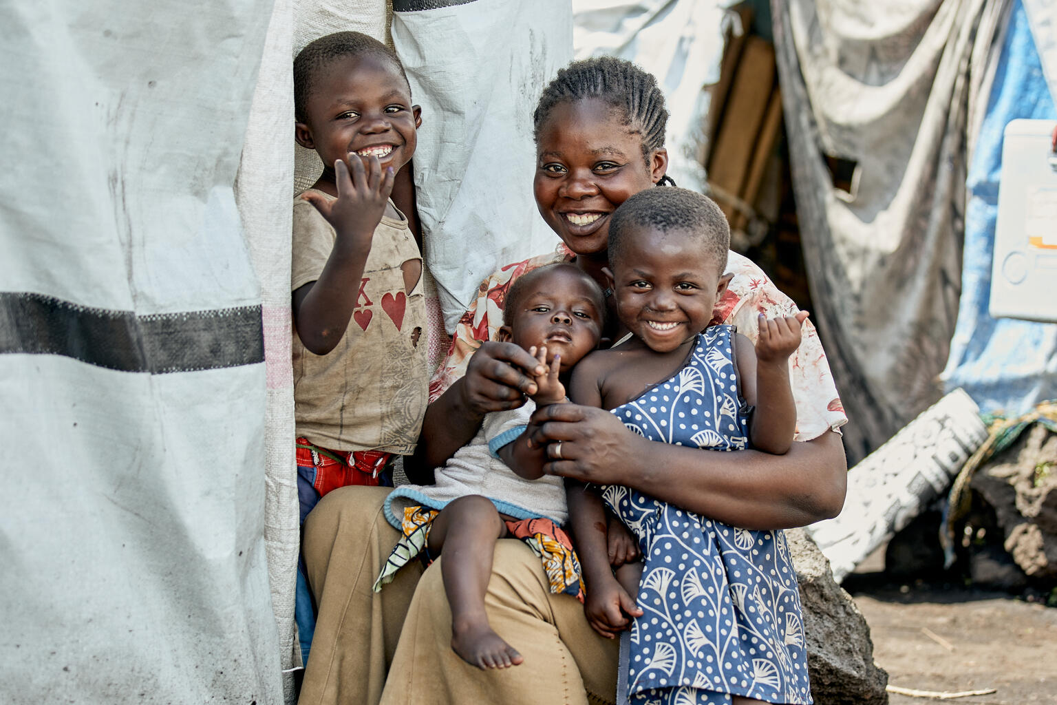 Polio eradication strategy 2022-2026: delivering on a promise, extension to 2029_cover Muhindo, 5, and his two sisters proudly show off thir marked fingers after being vaccinated against polio at the Buhimba IDP site in Goma, North Kivu, DR Congo, on April 10, 2024.