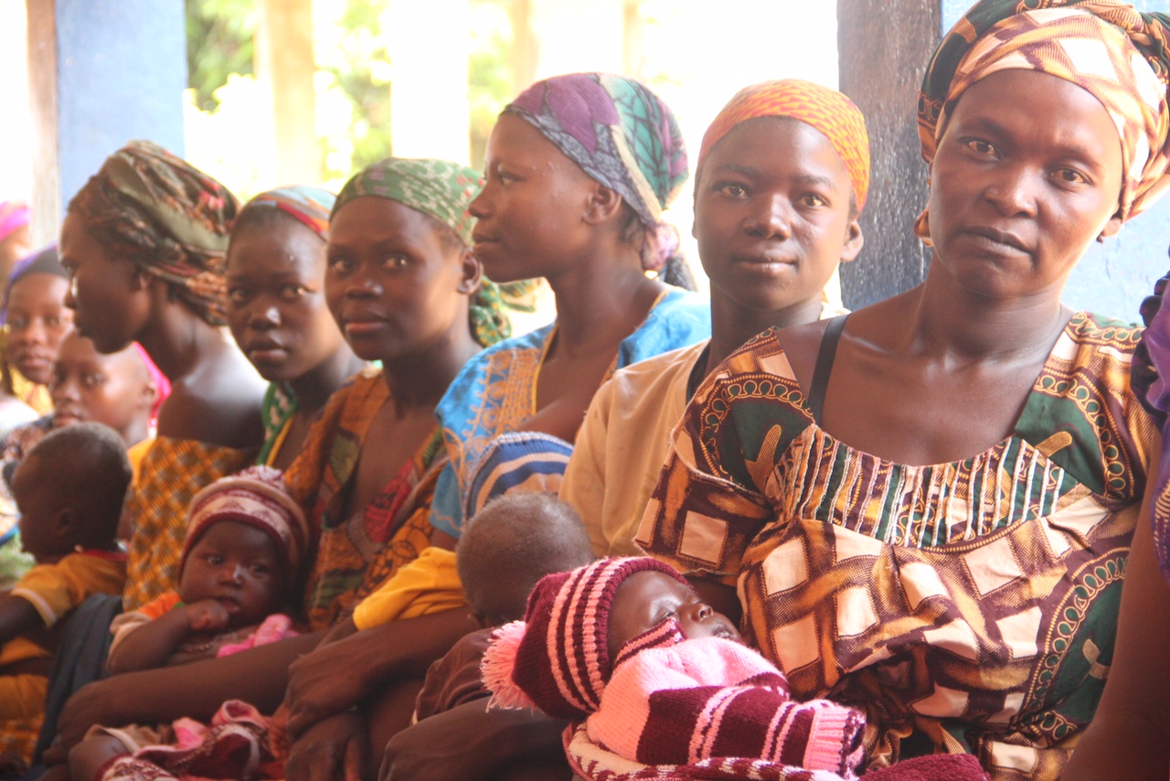 A group of woman holding their babies