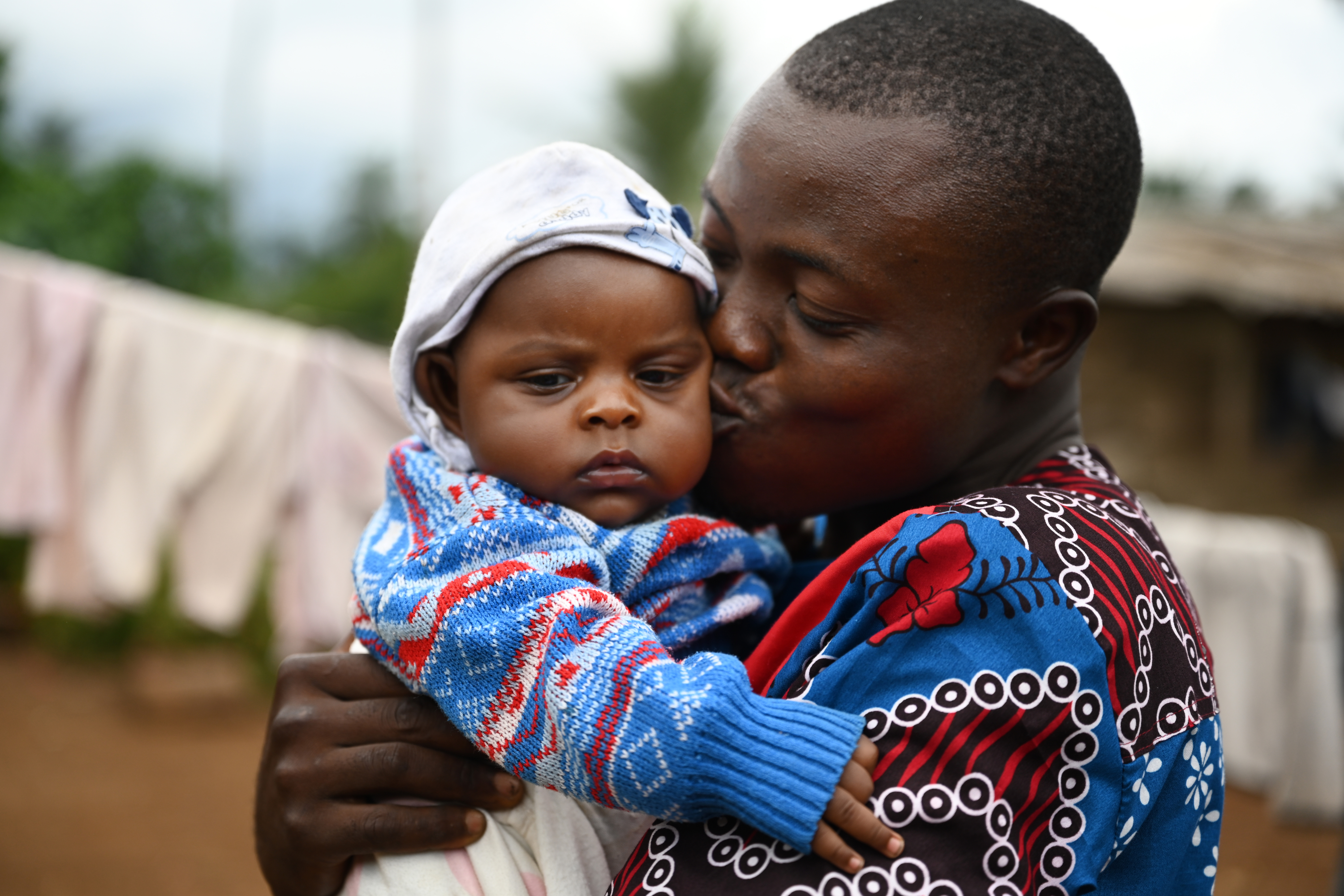 Dad kissing his baby