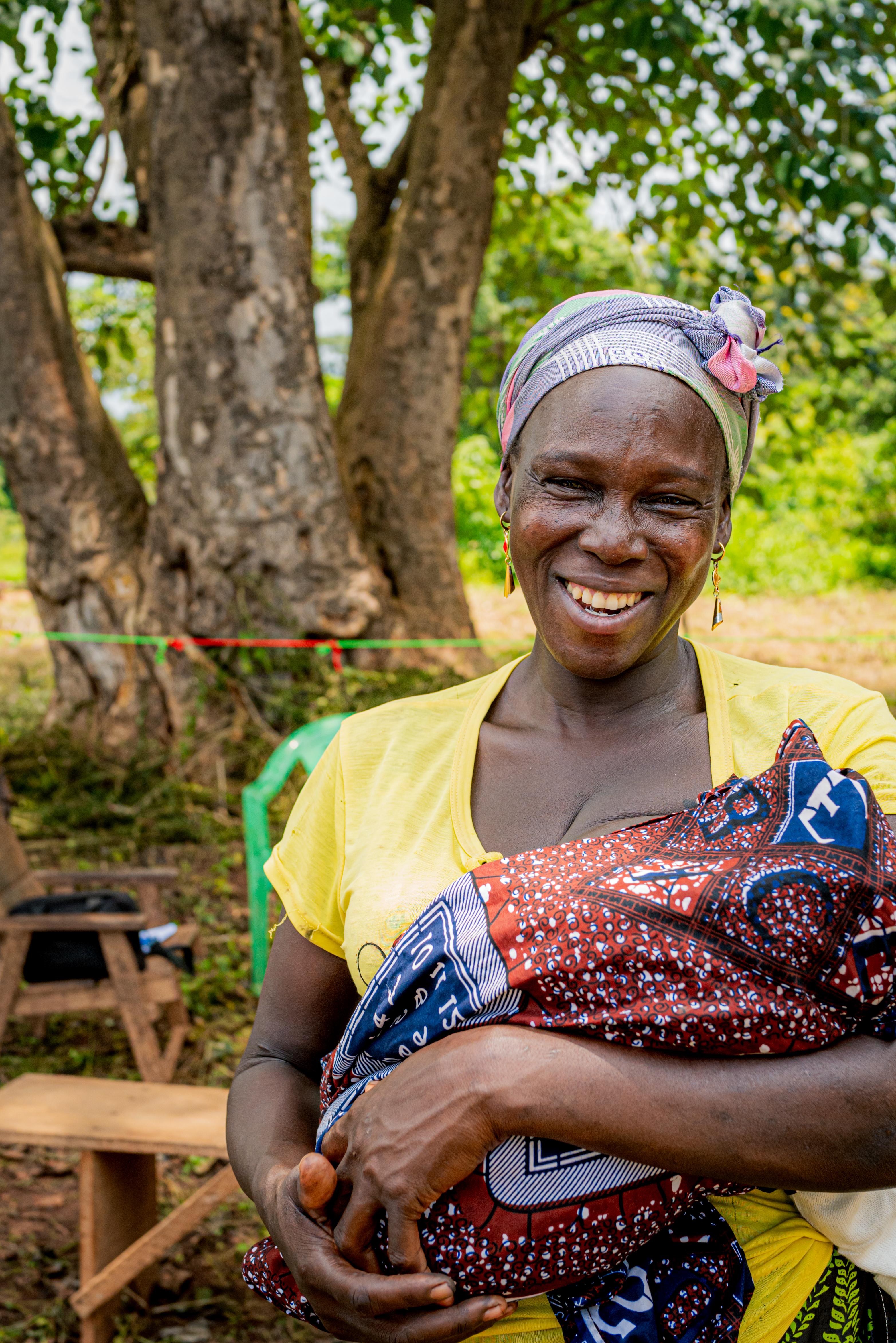 Mom holding her baby and smiling