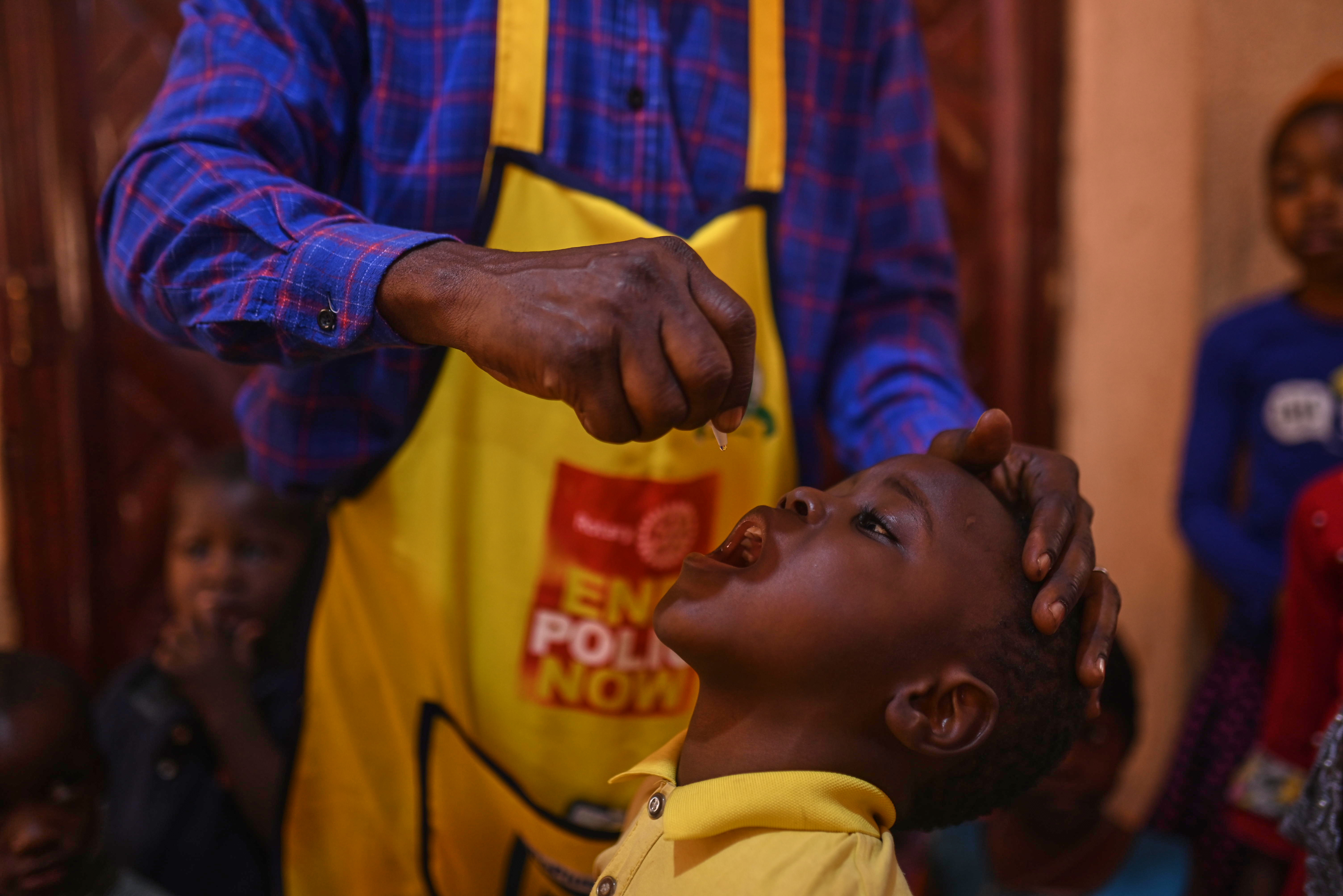 Children taking the polio vaccine drops.