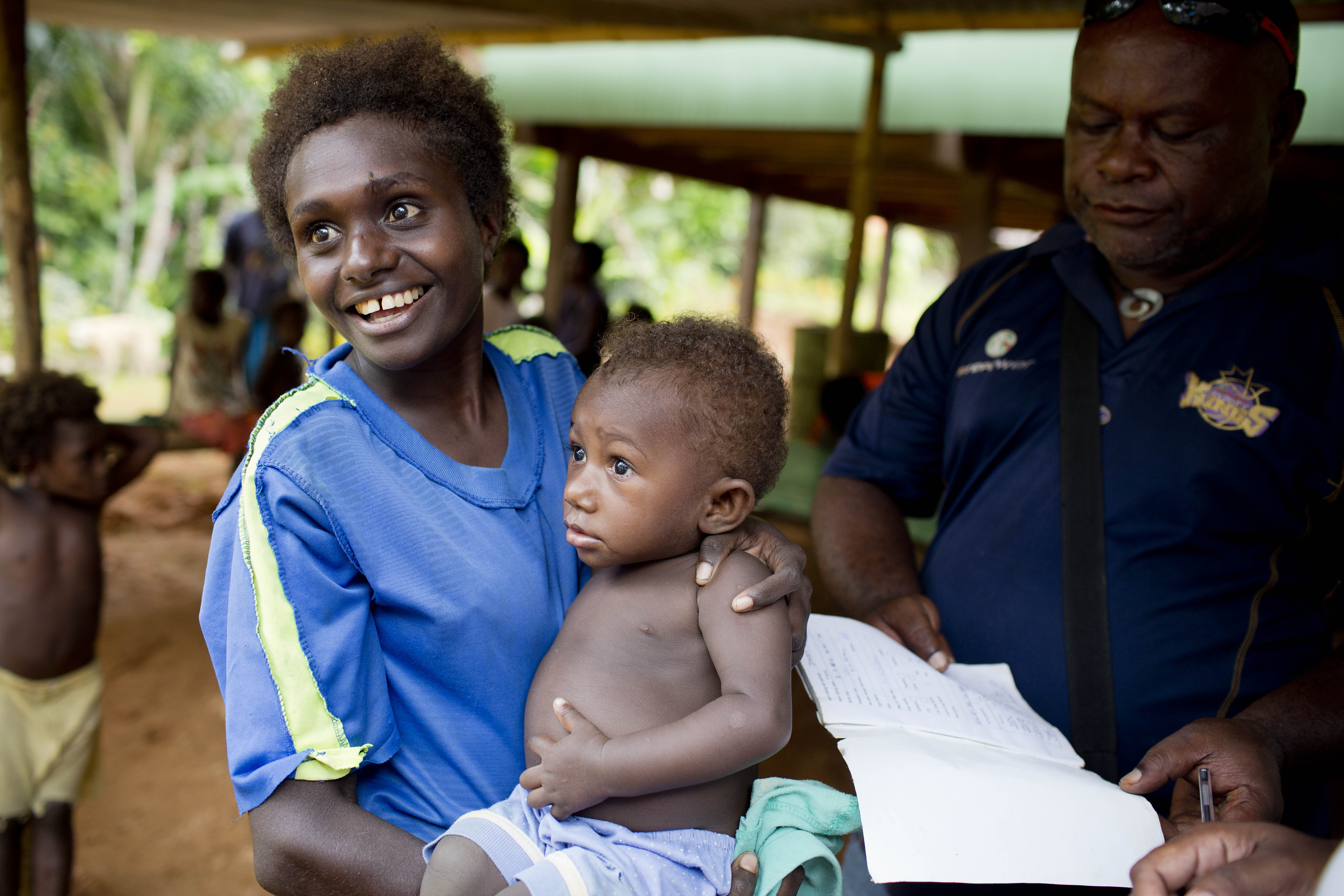 Mother taking child to get the vaccine