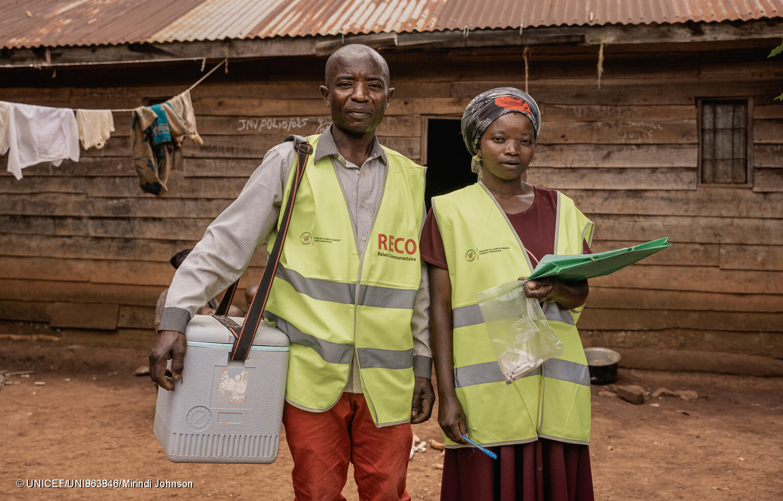 Two polio field workers in a village