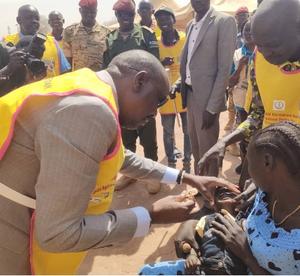 Local official administering the polio vaccine during the Polio SIA launch in South Sudan.