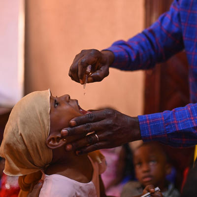 Children taking the polio vaccine drops