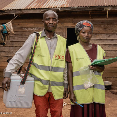 Two polio field workers in a village