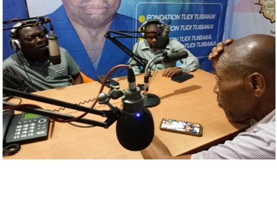 Three radio hosts in the DRC broadcast an awareness program on polio prevention, using local media to inform and educate the population about vaccination initiatives.