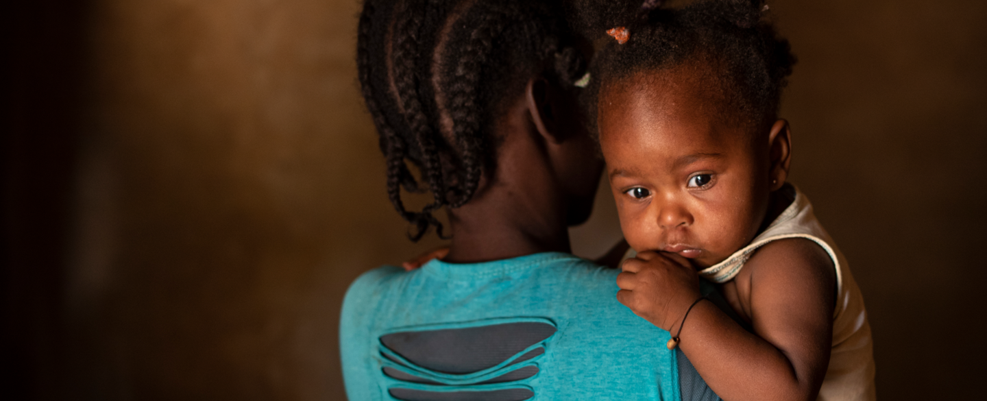 Woman holding child