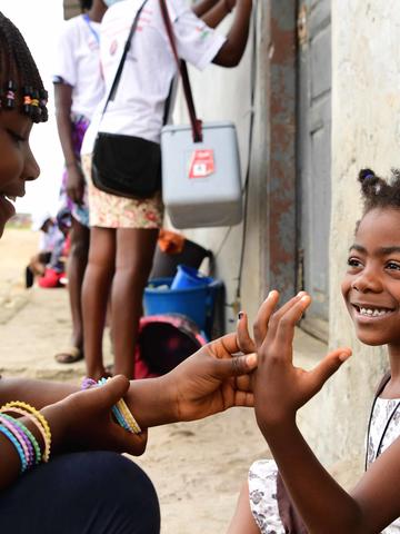 Cote d'Ivoire - Child and polio worker 